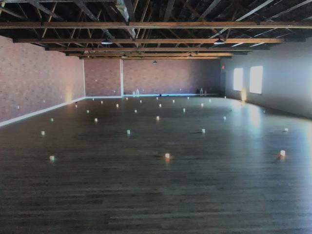 <p>Candles provide a safe distance between yoga students.</p>
<p>Ben Freda | For Abington Journal</p>