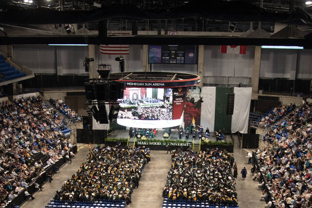 130649905_web1_2024-Marywood-Graduates
An aerial view of the graduates at Marywood Universitys 106th annual commencement ceremony, accompanied by the faculty and administration, and surrounded by family and friends in the packed arena. Marywood conferred degrees on undergraduate, graduate, and doctoral students who hail from 24 states and 7 countries.
