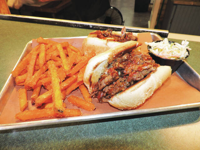130731379_web1_DSCN3606
Smoak BBQ Grill & Meatery offers a brisket cheesesteak with fries and cole slaw.
Ben Freda | For Abington Journal