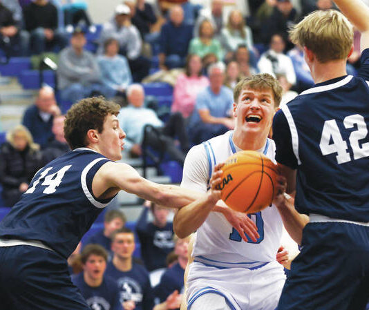 
			
				                                Dallas Pat Flanagan (10) looks to the basket as Abington Heights Andrew Kettle (14) and Brady Comstock double team him in the first quarter. Flanagan finished with 20 points and 11 rebounds.
                                 Fred Adams | For Times Leader

			
		