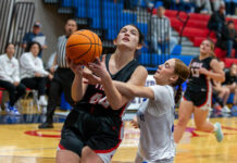 
			
				                                Madeleine Forrer (44) of Lackawanna Trail goes up for a contested layup against West Scrantons Aubrey Kerrigan during their consolation final of the Taylor Lions Tournament.
                                 Buck Norton-Jennings | For Abington Journal

			
		