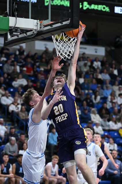 <p>Scranton Prep’s Packy Doherty (20) scores on a reverse lay up against Dallas Area on Saturday afternoon at the Mohegan Sun Arena for the PIAA D2 4A championship.</p>
<p>Tony Callaio | For Abington Journal</p>