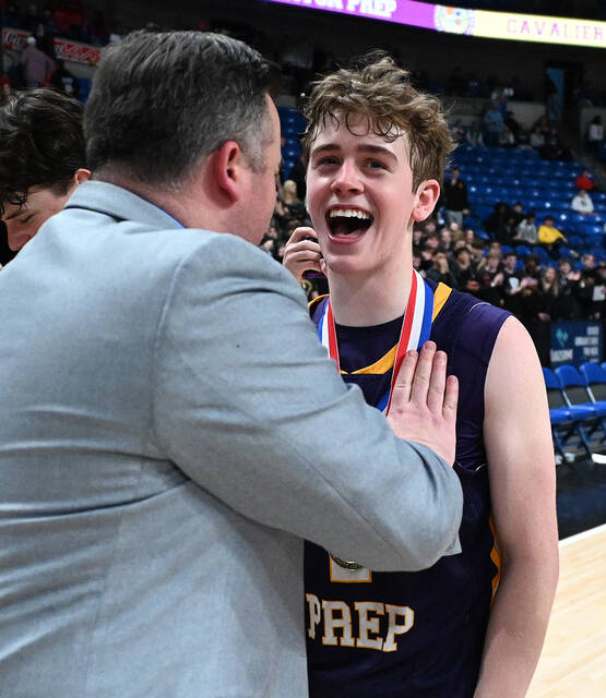 <p>Scranton Prep senion Brody Martin gets his medal from Prep Head Coach Larry Reagan after defeating Dallas Area for the PIAA D2 4A championships.</p>
<p>Tony Callaio | For Abington Journal</p>