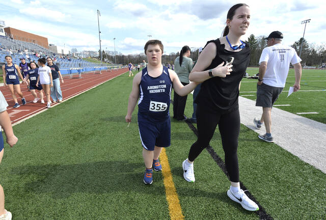 132281485_web1_UnifiedTrack01
Jacob Butler is escorted to the team meeting.
Mark Moran | For Abington Journal