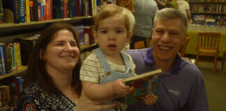 
			
				                                12-month-old Jordan Sholes, here with his parents, Greg and Kayla Sholes, of Dalton, is starting his book collection early.
                                 Mauri Rapp | For Abington Journal

			
		
