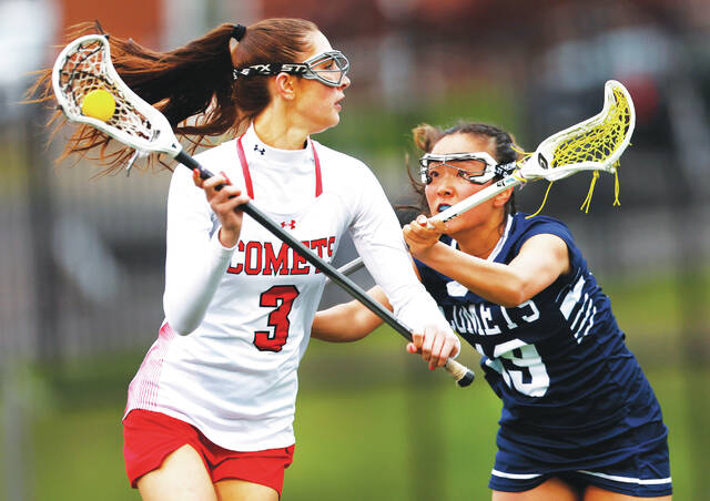 <p>Crestwood attacker Jackie Gallagher looks to pass as Abington Heights defender Olivia Kim looks to block in the second quarter.</p>
<p>Fred Adams | For Abington Journal</p>