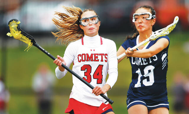 <p>Crestwood midfielder Jordan Andrews tries to elude Abington Heights defender Olivia Kim in the first quarter.</p>
<p>Fred Adams | For Abington Journal</p>