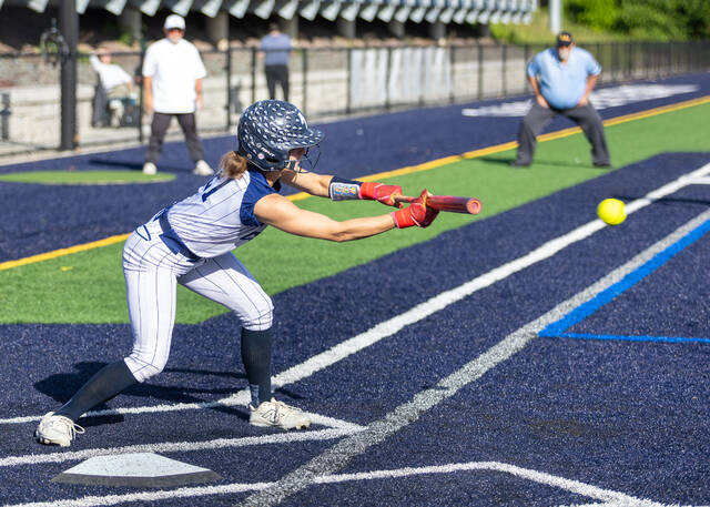 <p>Riley McColligan, lays down a bunt to advance a runner into scoring position for the Lady Comets.</p>