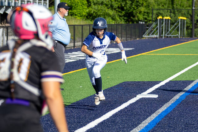 132395998_web1_20260601ahum--19-of-25-
Abington Heights Bri Bustos is determined to score from third base.